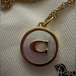 NWT COACH Signature C mother of pearl and gold coin pendant necklace